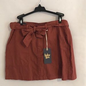 rusty red colored skirt with bow belt